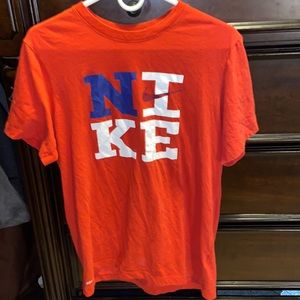 Red white and blue Nike shirt